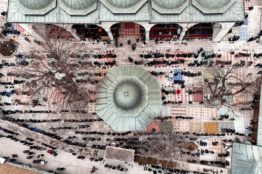 A drone view shows Muslims attending Eid al-Fitr prayers marking the end of the holy fasting month of Ramadan near the Gazi Husrev-beg Mosque in Sarajevo, Bosnia and Herzegovina, March 20, 2026. 