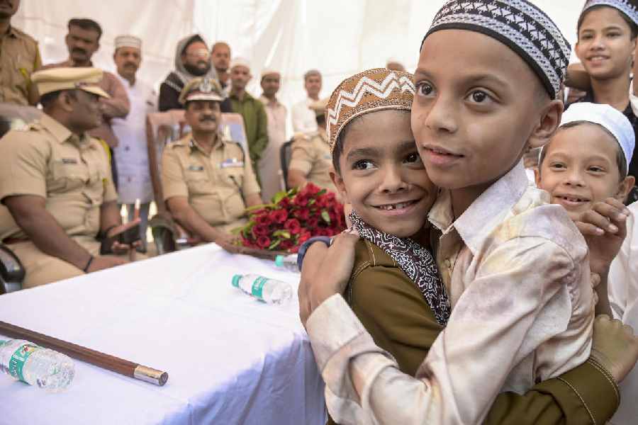Children greet each other on the occasion of Eid al-Fitr, at Jama Masjid in Nagpur, Maharashtra, Saturday, March 21, 2026.
