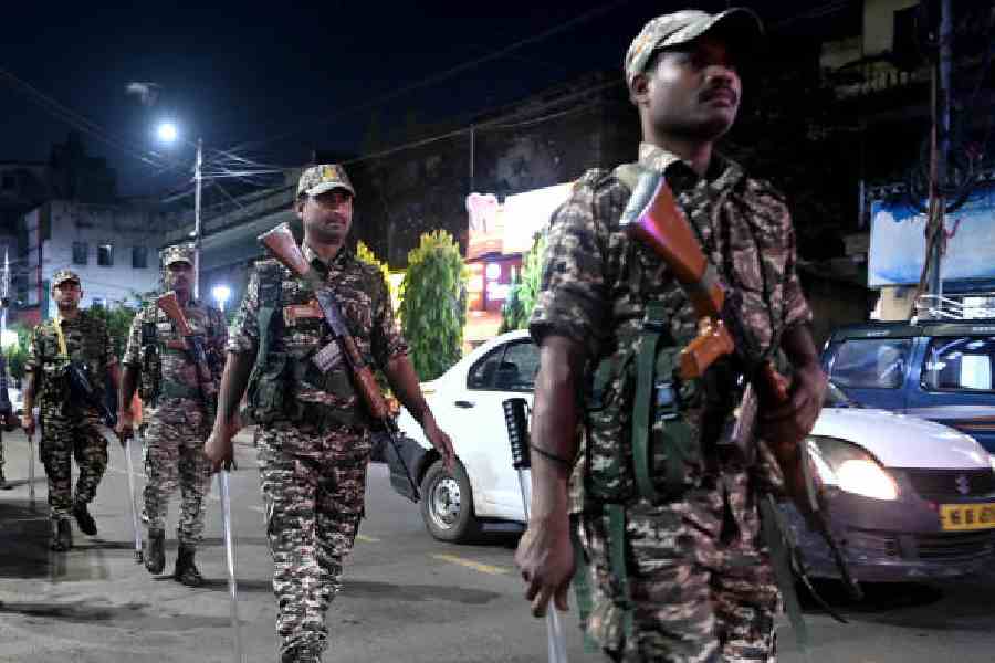 Central force jawans on a route march in the Chetla area on Saturday evening. Picture by Sanat Kr Sinha