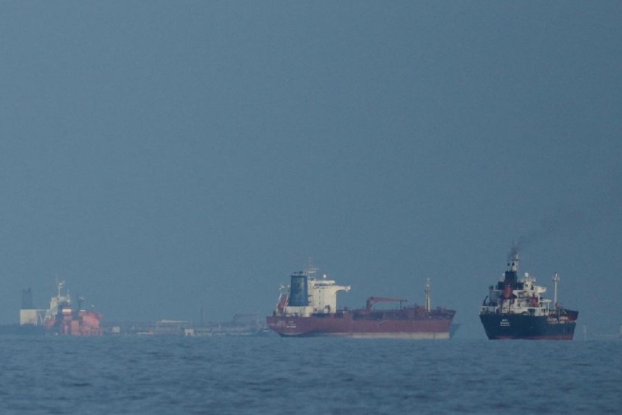 Oil tankers and cargo ships line up in the Strait of Hormuz as seen from Mina Al Fajer, United Arab Emirates, Wednesday, March 11, 2026.