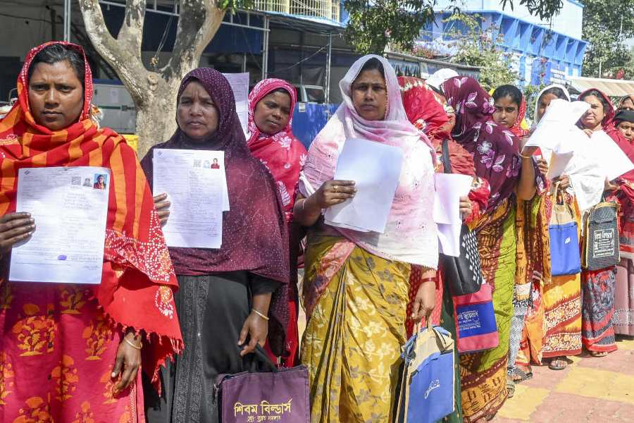 People wait in queues during hearings under the Special Intensive Revision of electoral rolls, at Krishnanagar, in Nadia, West Bengal, Saturday, Feb. 7, 2026.