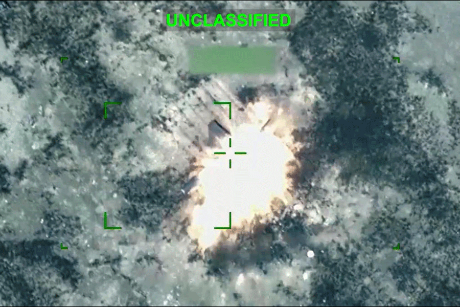 An explosion following what the U.S. Central Command says is a strike on an Iranian one-way attack drone at an unknown location