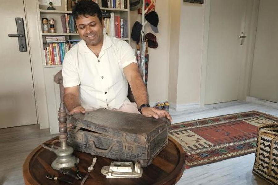 Trinankur Banerjee opens a briefcase used by his grandfather Bibhutibhushan Bandyopadhyay to carry his manuscripts.