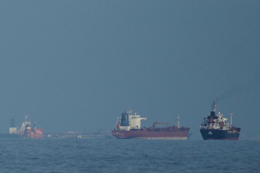 Oil tankers and cargo ships line up in the Strait of Hormuz as seen from Mina Al Fajer, United Arab Emirates, Wednesday, March 11, 2026.