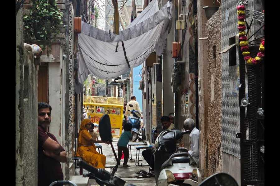 Tarun's house with his family members sitting outside
