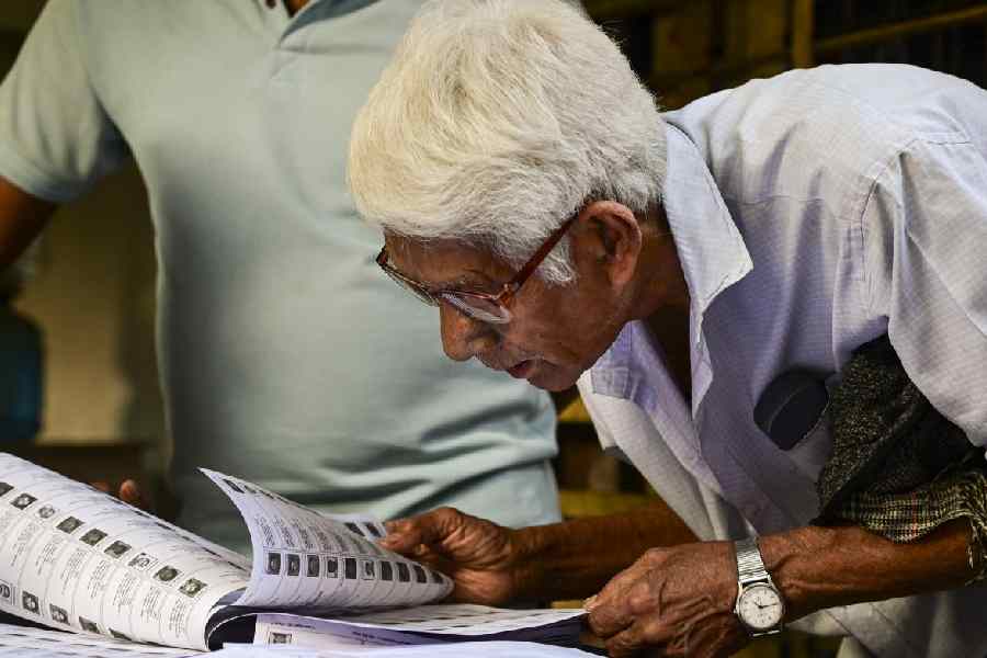 A voter checks his name in West Bengal’s post-SIR electoral rolls published by the Election Commission of India