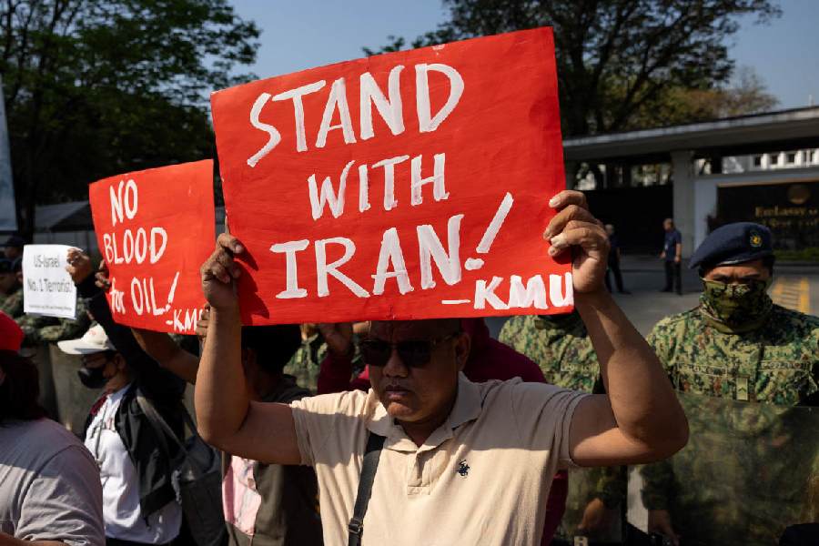 Filipino activists protest outside the US Embassy amid the U.S.-Israel conflict with Iran, in Manila, Philippines, March 23, 2026.