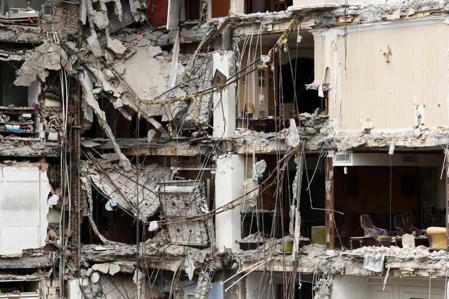 A view of a residential building damaged by a strike, amid the U.S.-Israeli conflict with Iran, in Tehran, Iran, March 23, 2026.