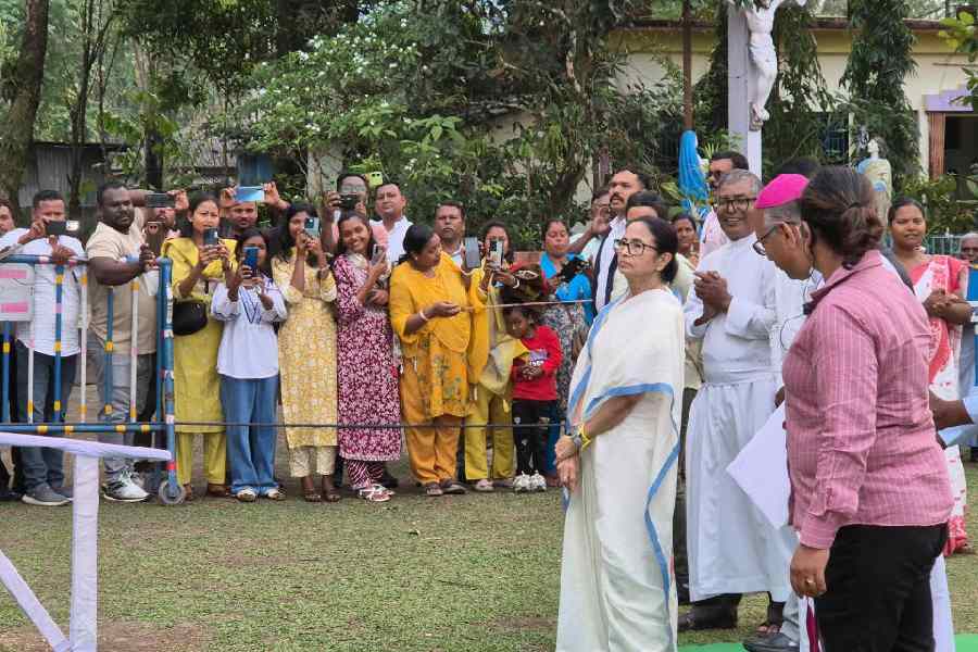 Mamata Banerjee on the premises of  St Lucy Church in Chalsa on Tuesday.