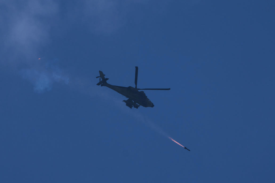 An Israeli Apache helicopter fires a missile towards southern Lebanon as seen form northern Israel, Monday, March 23, 2026.