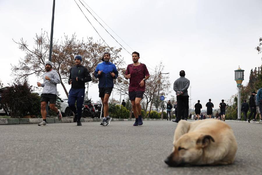 Iranian people exercise at Pardisan Park, amid the US-Israeli conflict with Iran, in Tehran, Iran, March 25, 2026.