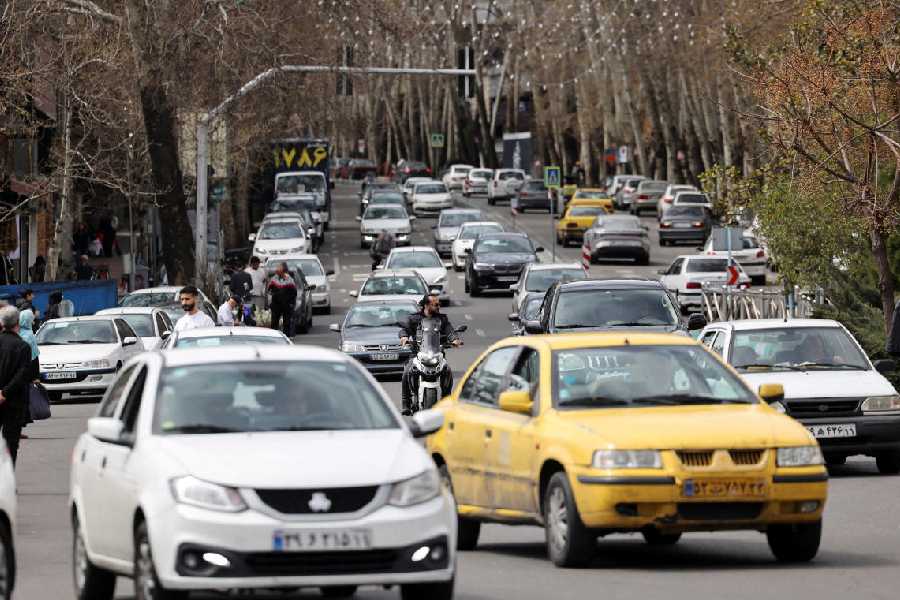 Motorists on a street, amid the US-Israeli conflict with Iran, in Tehran, Iran, March 24, 2026. 