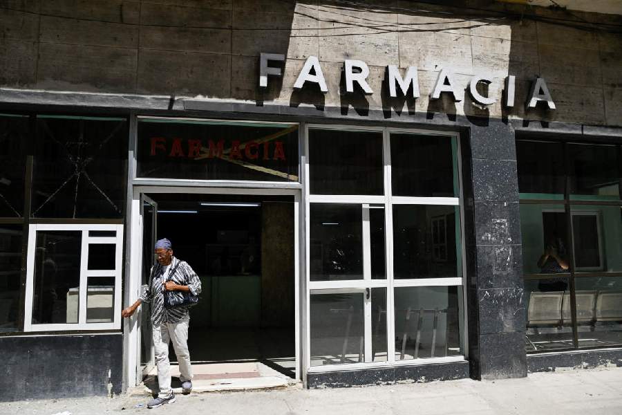 A woman leaves a pharmacy as Cuba’s once-vaunted healthcare system, long hailed as a cornerstone of the 1959 revolution, has deteriorated amid years of economic crisis, March 24, 2026.