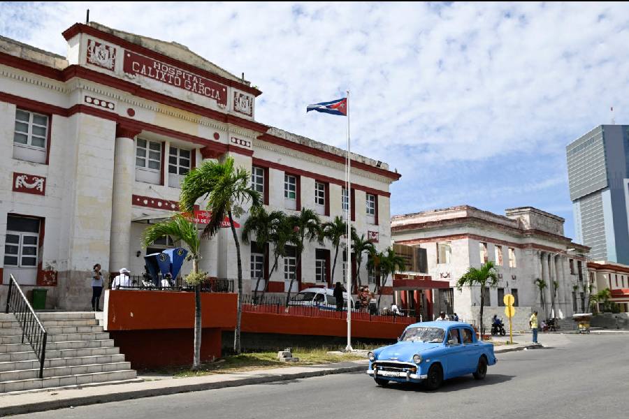 A vintage car passes by the Calixto Garcia hospital as Cuba’s once-vaunted healthcare system, now in decline, accelerated this year with US restrictions on oil supplies, in Havana, Cuba. 