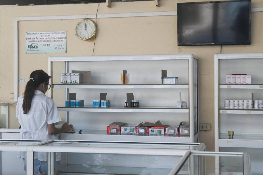 A woman works inside a pharmacy as Cuba’s once-vaunted healthcare system, in Havana, Cuba, March 24, 2026. 