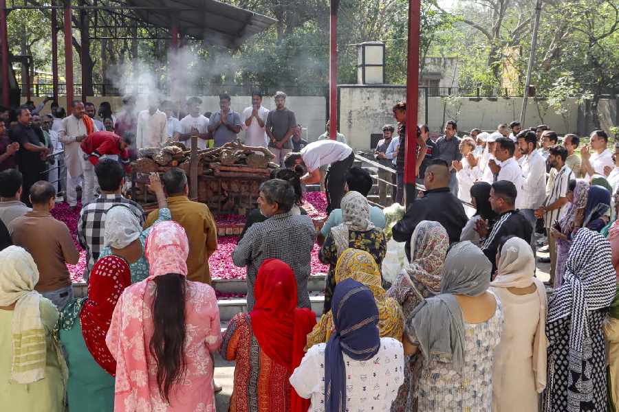 Family members of Harish Rana, the first person in India to be allowed passive euthanasia, during his last rites, at Green Park Cremation Ground in New Delhi, Wednesday, March 25, 2026.
