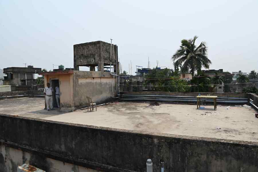 Police on the terrace of the apartment building where the shooting took place on Thursday. 