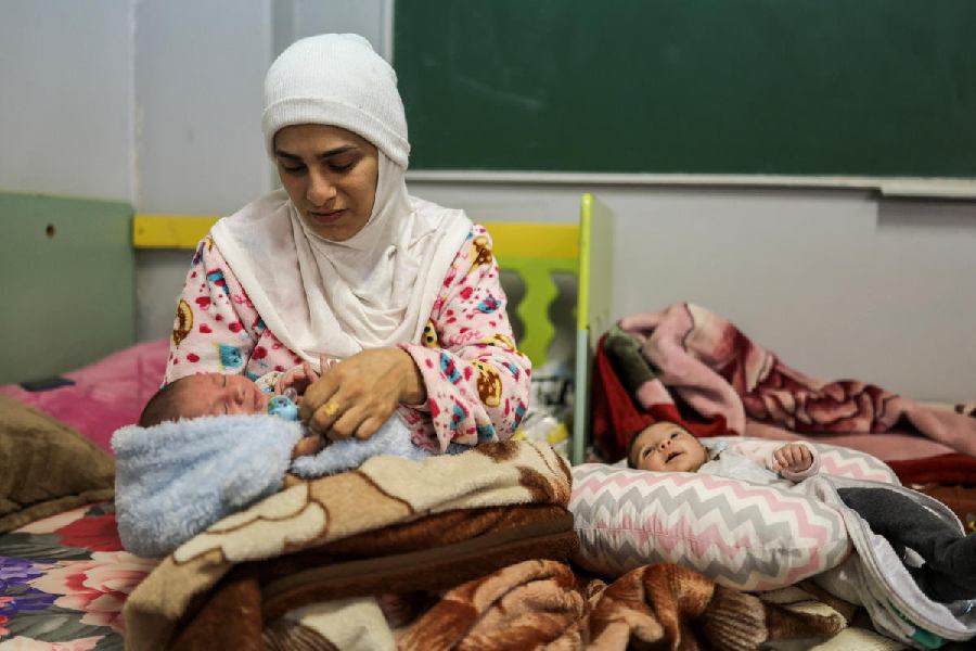 Hawraa Houmani, 29, holds her newborn Ali, in a school now used as a temporary shelter for displaced people, in Beirut, Lebanon