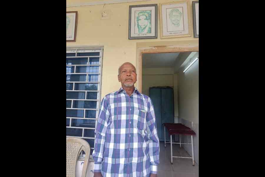 A martyr’s kin at the Free Medical Centre in Bhangabera. Behind him are portraits of martyrs