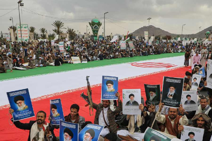 Houthi supporters hold posters of Iran's late Supreme Leader, as they protest the war on Iran, in Sanaa, Yemen, Friday, March 6, 2026