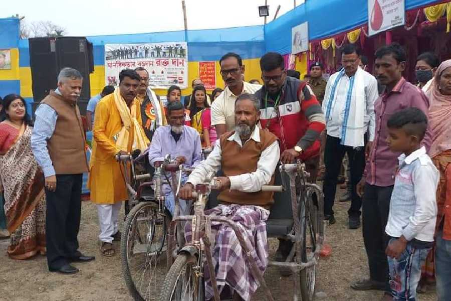 Das donates wheelchairs to the elderly at a camp in north Bengal
