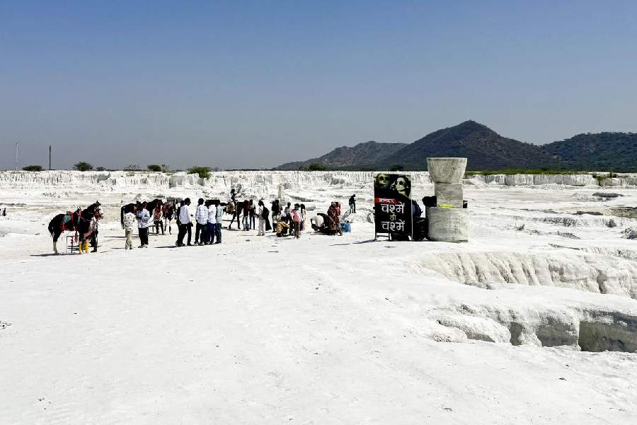 People visit the marble waste dumping yard, in Kishangarh, Rajasthan, Friday, March 27, 2026.