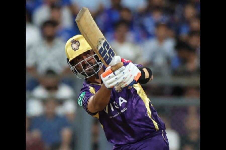 Ajinkya Rahane (left) launches a big one as Ryan Rickelton looks on at the Wankhede on Sunday. The Kolkata Knight Riders captain played a fine innings of 67 off 40 balls. (Reuters) 