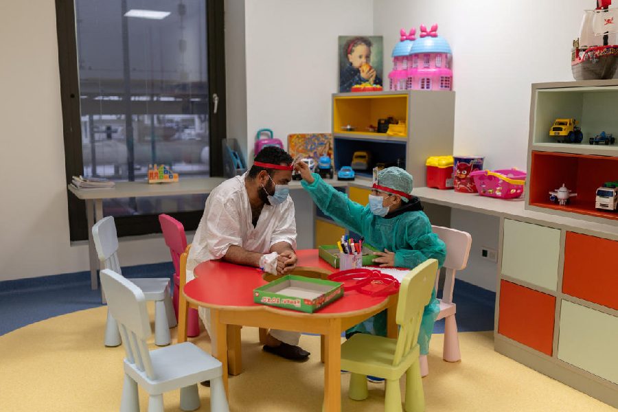 Syrian refugee Yahia Aldarwish, 10, plays a board game with his father Abdulaziz Aldarwish, 32, following a successful kidney transplant with his father as donor at the Onassis National Transplant Center in Athens, Greece, January 29, 2026.
