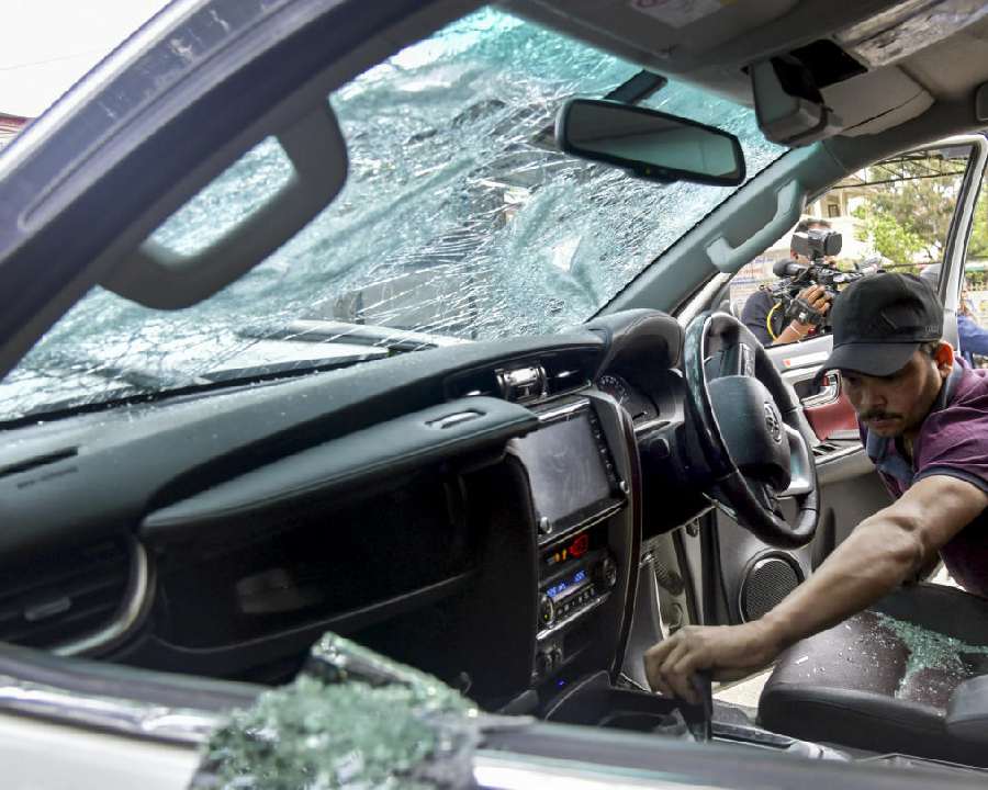 Officials investigate the crime scene after 74-year old retired Army brigadier Mukesh Joshi was killed as he was caught in cross firing between two car occupants during a road rage incident, in Dehradun, Uttarakhand, Monday, March 30, 2026.