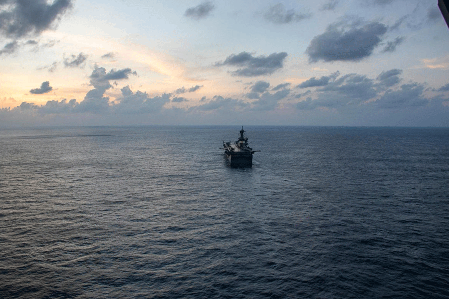 The USS Tripoli (LHA-7) amphibious assault ship sails at a location given as the Indian Ocean, amid the U.S.-Israeli conflict with Iran, in this handout image released March 30, 2026.