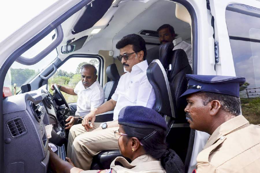 Election flying squad officials check the vehicle of Tamil Nadu Chief Minister MK Stalin at Saliamangalam junction on the Tiruchi-Nagapattinam highway as he proceeds to Tiruvarur for an election campaign, in Tiruchirappalli, Tuesday, March 31, 2026.
