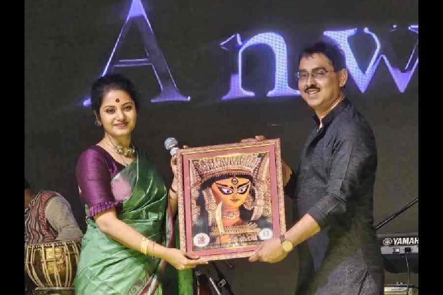 Joint treasurer Abhijit Rakshit greets Anweshaa Dutta Gupta