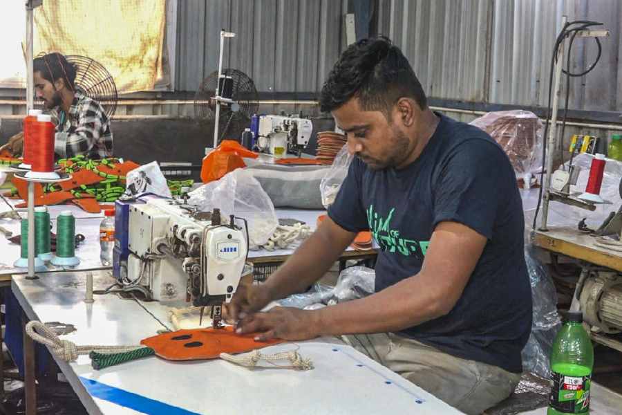 Workers at a leather toy manufacturing factory, in Kanpur, Wednesday, Aug. 27, 2025.