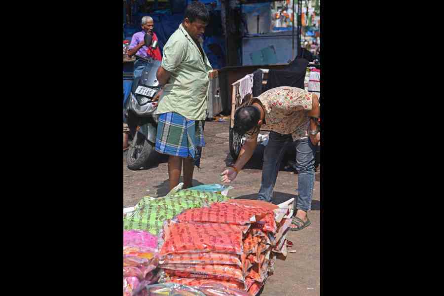 Green and orange abir on sale in Burrabazar on Sunday