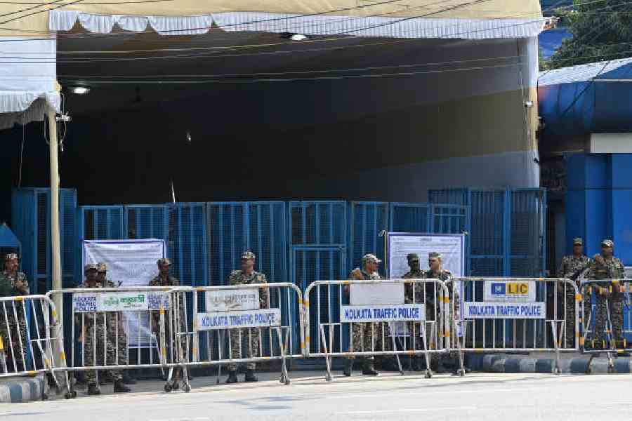 Security personnel stand guard outside the strongroom at Khudiram Anushilan Kendra on Sunday. Picture by Sanat Kr Sinha