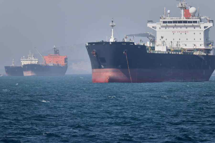 Oil tankers sit at anchor offshore in the Strait of Hormuz off Bandar Abbas, Iran, Saturday, May 2, 2026.