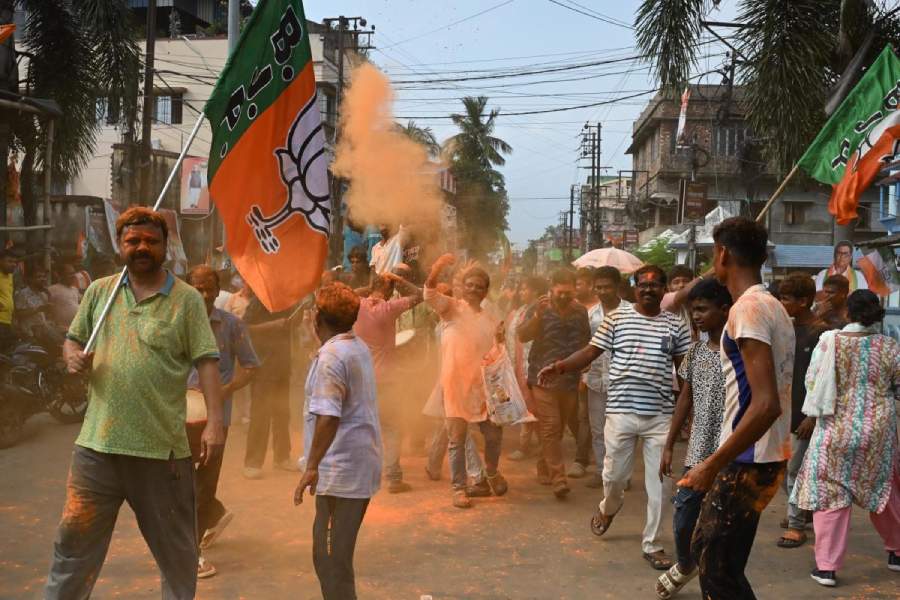 BJP supporters celebrate outside a counting centre in Ranaghat town on Monday afternoon. 