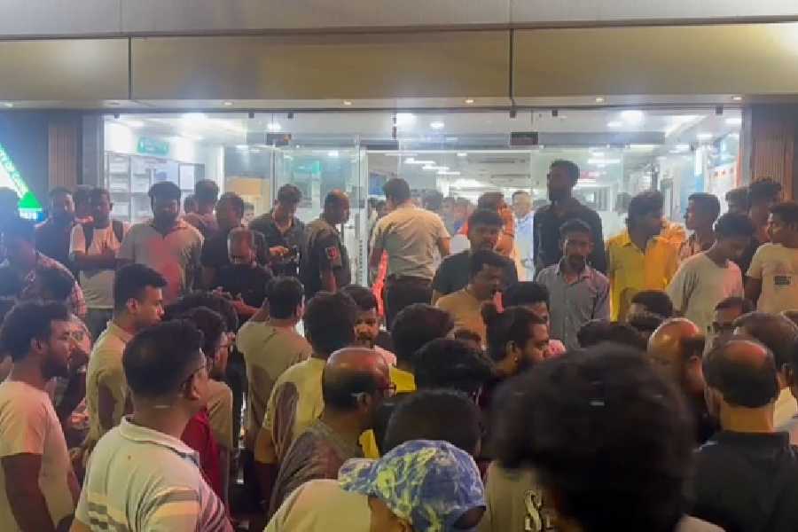 A crowd gathers at Vivacity Multispecialty Hospital in Madhyamgram, near Kolkata, where Suvendu Adhikari's personal assistant was admitted after being shot, on Wednesday, May 6, 2026.
