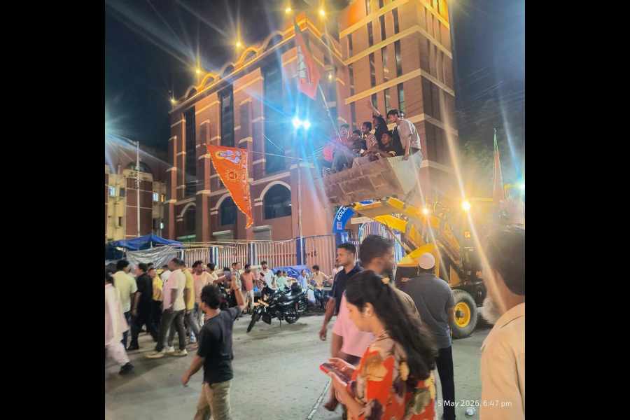BJP supporters on a bulldozer in New Market on Tuesday