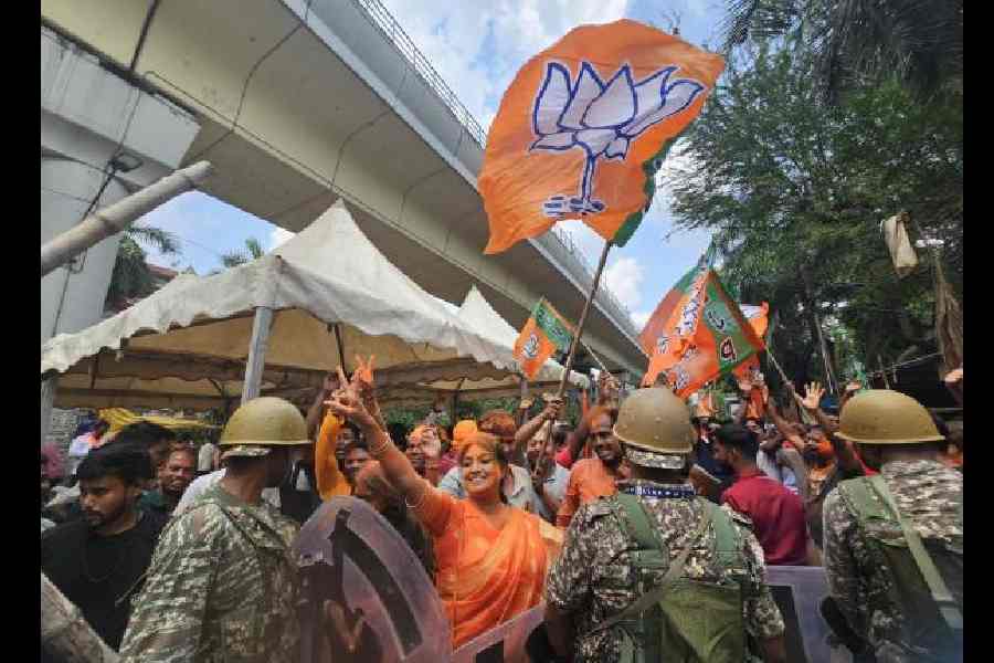 BJP supporters celebrate the party’s landslide victory in front of the counting centre at Bidhannagar College on Monday