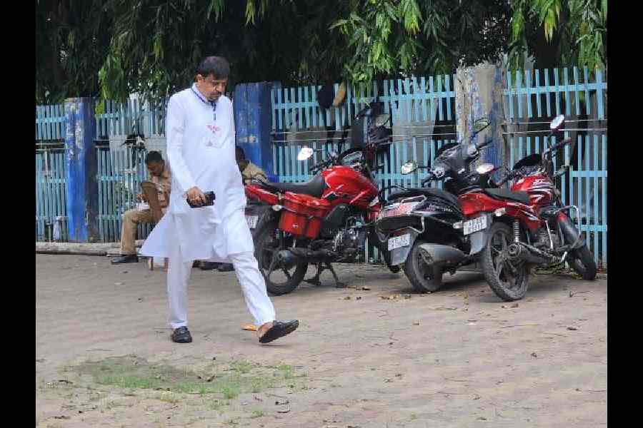 Sujit Bose of Trinamul Congress leaves the counting hall at 1pm after conceding a lead in South Dum Dum  