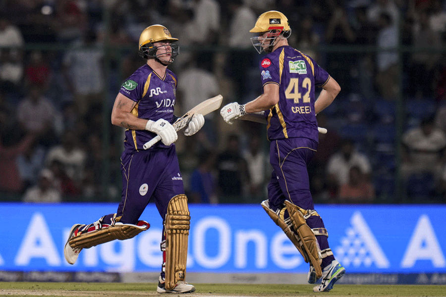 Kolkata Knight Riders' Finn Allen, left, and Cameron Green run between the wickets