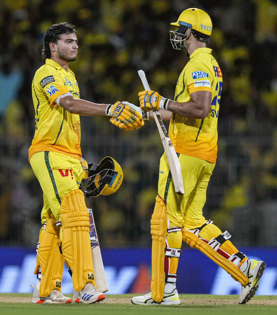 Chennai Super Kings' Prashant Veer, left, and Shivam Dube greet each other