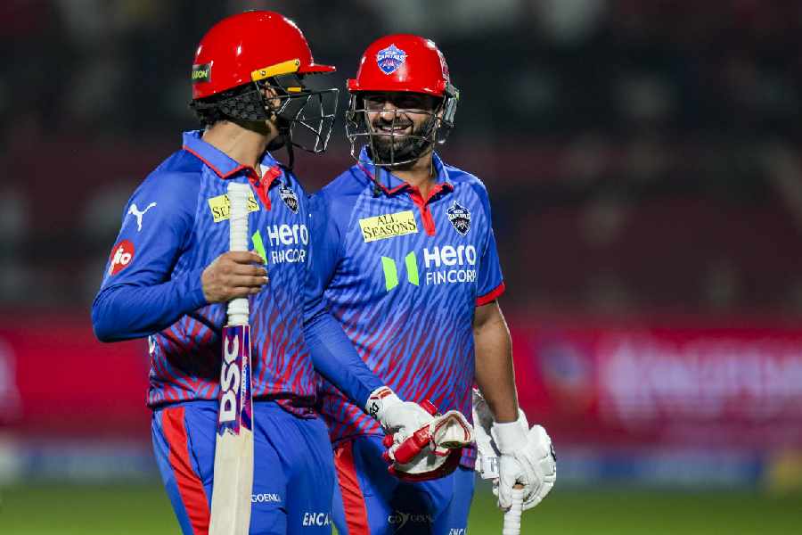 Delhi Capitals' Auqib Nabi, right, and Madhav Tiwari celebrate