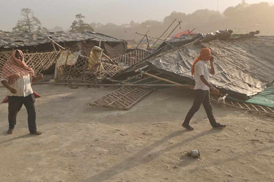 Commuters make their way through a dust storm