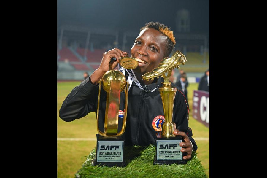 East Bengal women's team striker Fazila Ikwaput of Uganda celebrates with the SAFF Women's Club Championship Golden Boot and Most Valuable Player awards in Kathmandu in December last year. (Emami East Bengal)
