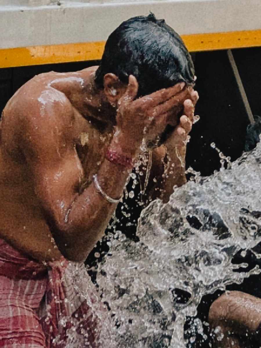 City ghats see a surge in visitors as people seek relief from the intense heat and humidity