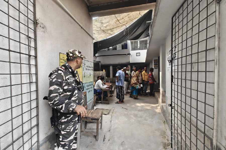 A security guard at the Srirampur Paschim Durgapur Primary School in Falta, a booth where Jahangir Khan, the Trinamool candidate who quit from the fray on Tuesday, was supposed to vote but did not on Thursday 