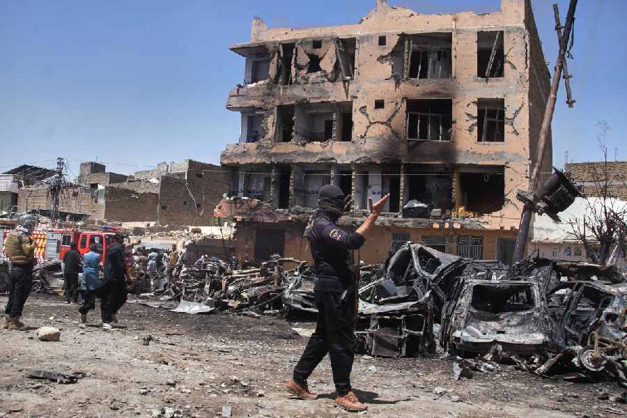 Police officers examine damages at the site of bomb explosion, in Quetta, Pakistan, Sunday, May 24, 2026.