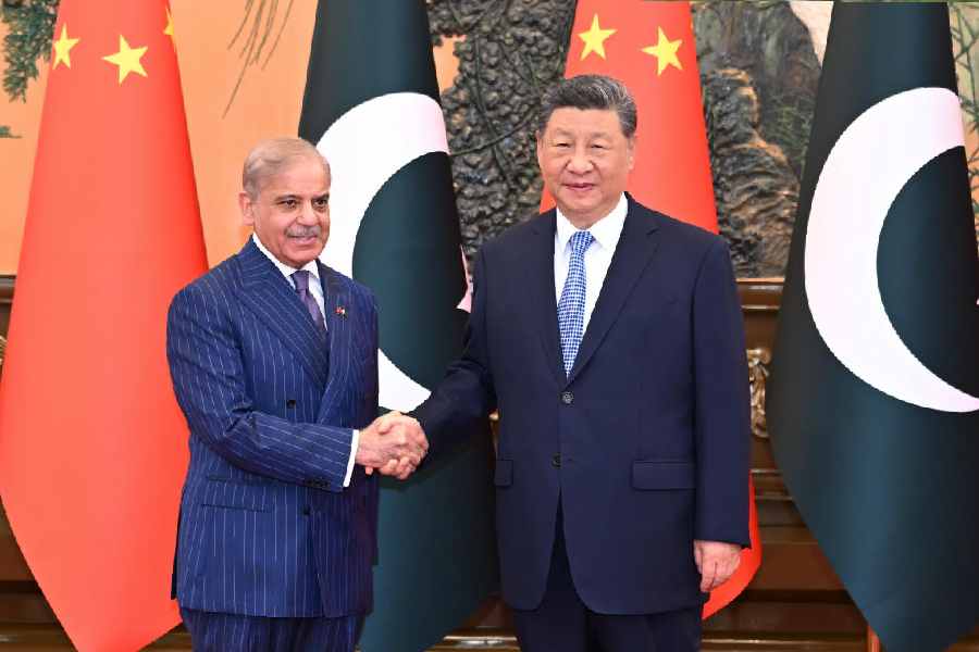 Pakistan\'s Prime Minister Shehbaz Sharif, left, shakes hands with Chinese President Xi Jinping prior to a bilateral meeting in Beijing, Monday, May 25, 2026.